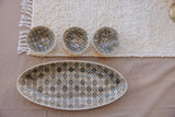 The Hostess — oval bamboo dish and three ramekins flat lay